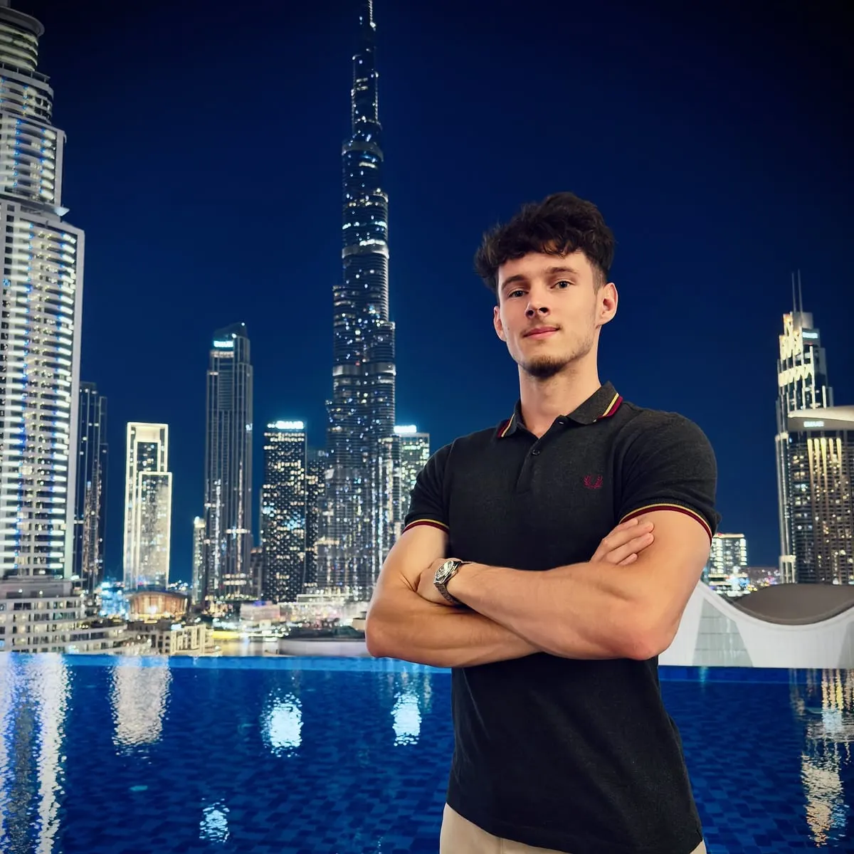 Denis Subic in front of the Burj Khalifa at night, Dubai