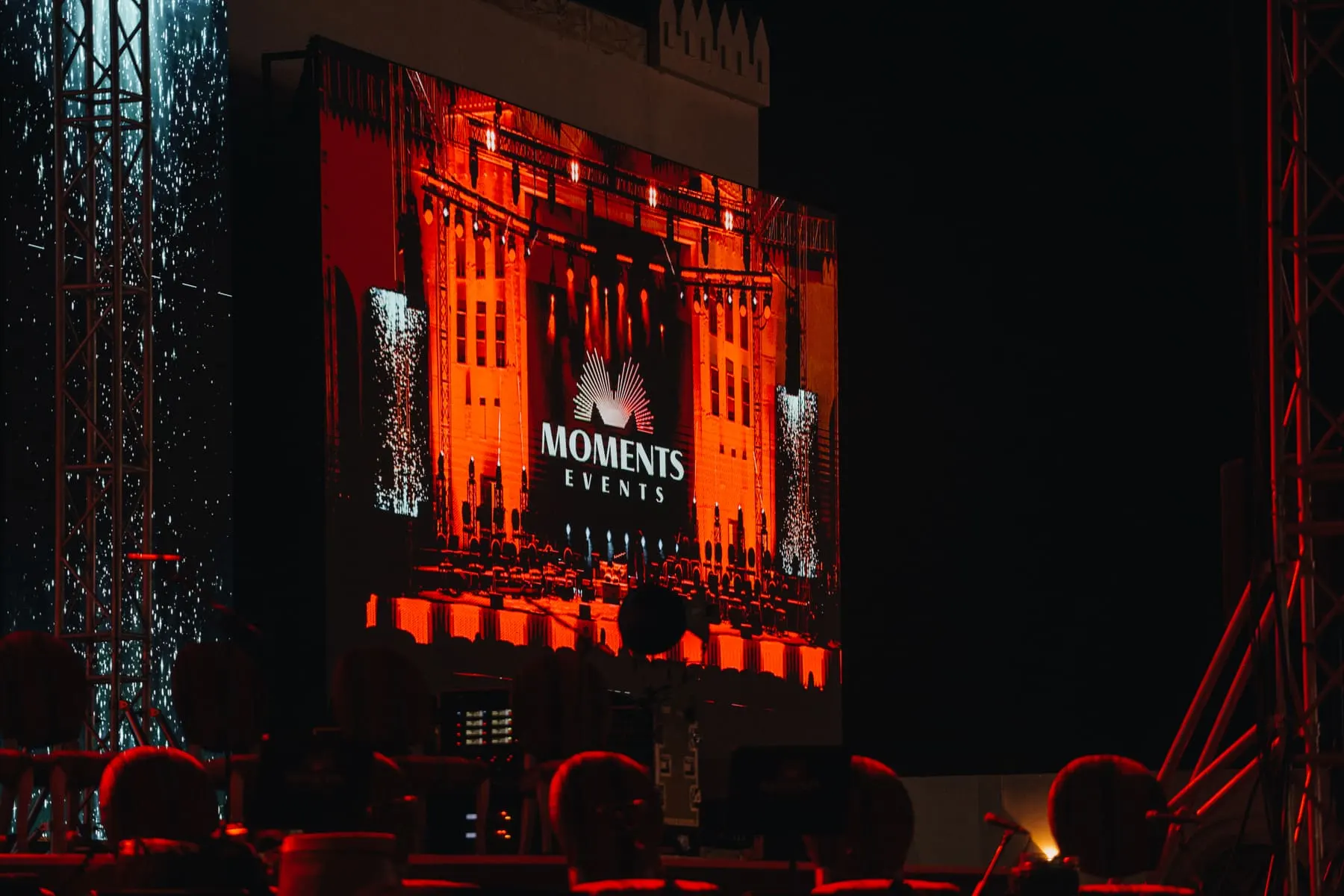 Festival stage with a large screen and red lighting — Mahmod Al Turky & Yara — live in Abu Dhabi, Sheikh Zayed Festival — Agency Verse