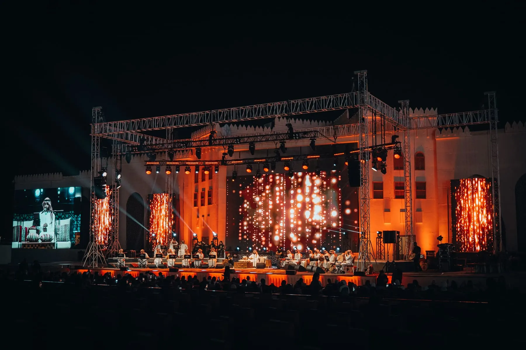 Festival stage lit in red — Mahmod Al Turky & Yara — live in Abu Dhabi, Sheikh Zayed Festival — Agency Verse