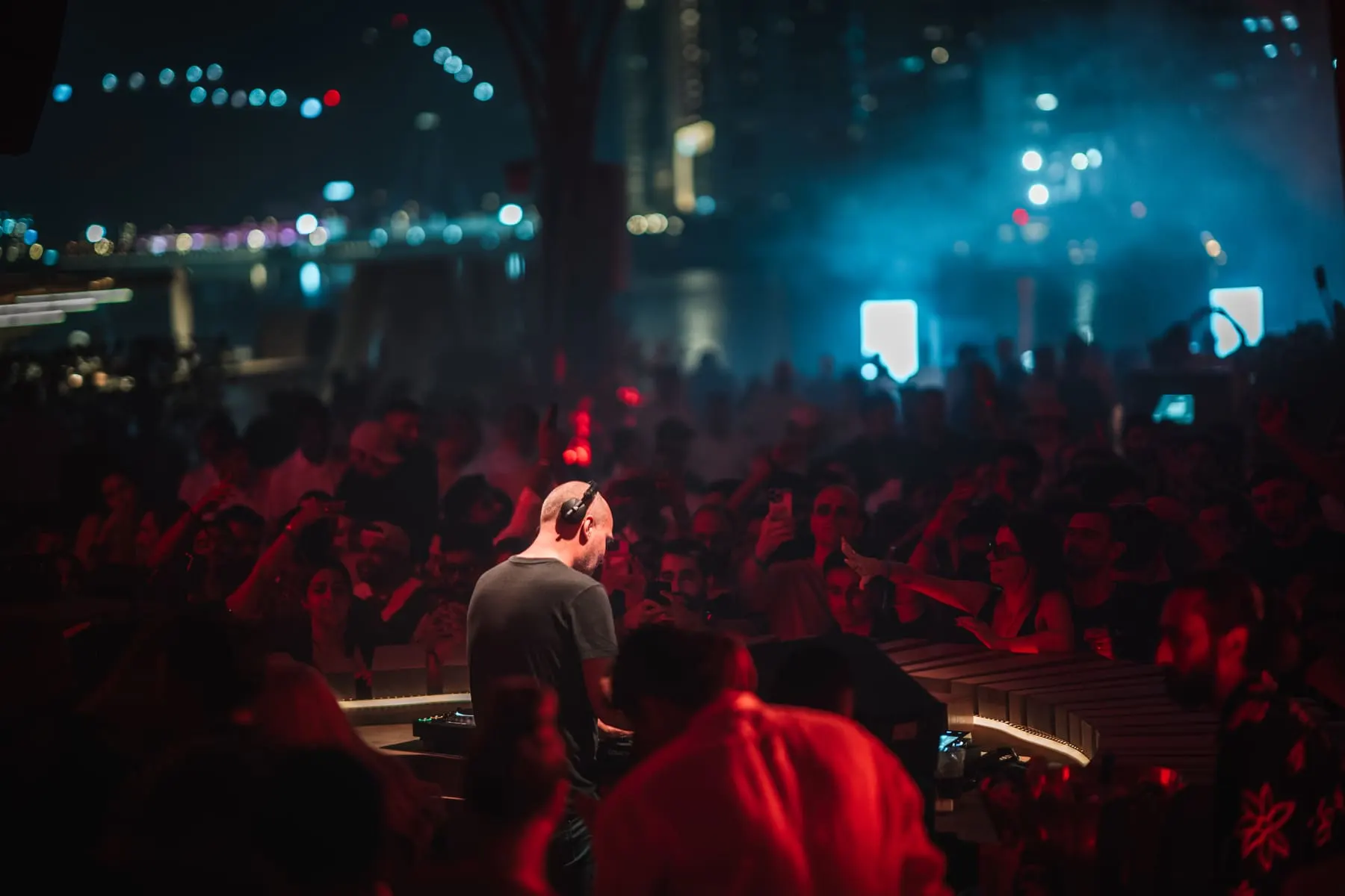 Packed crowd facing the stage under blue and red lights — Anjuna Deep, Bohemia, FIVE Palm Jumeirah, Dubai — Agency Verse