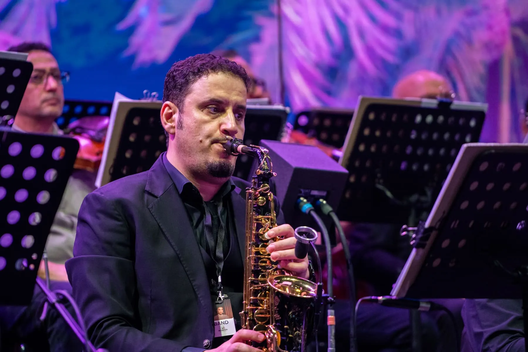 Saxophonist performing with the orchestra — Assala — live at Sheikh Zayed Festival, Abu Dhabi — Agency Verse
