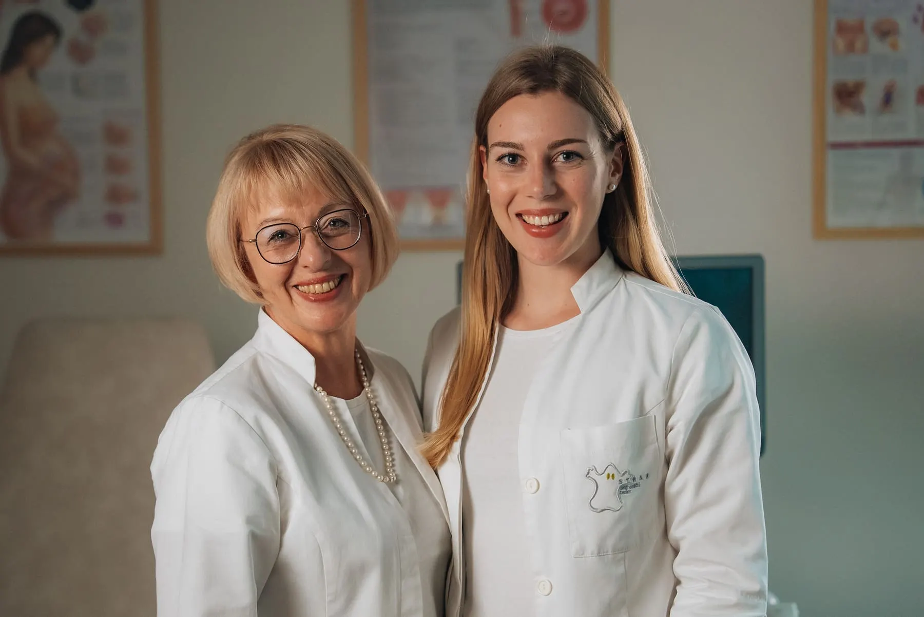 Doctor-led explainer films — Two doctors in white coats smiling in the clinic — Dr. Strah — women’s health reels — Agency Verse