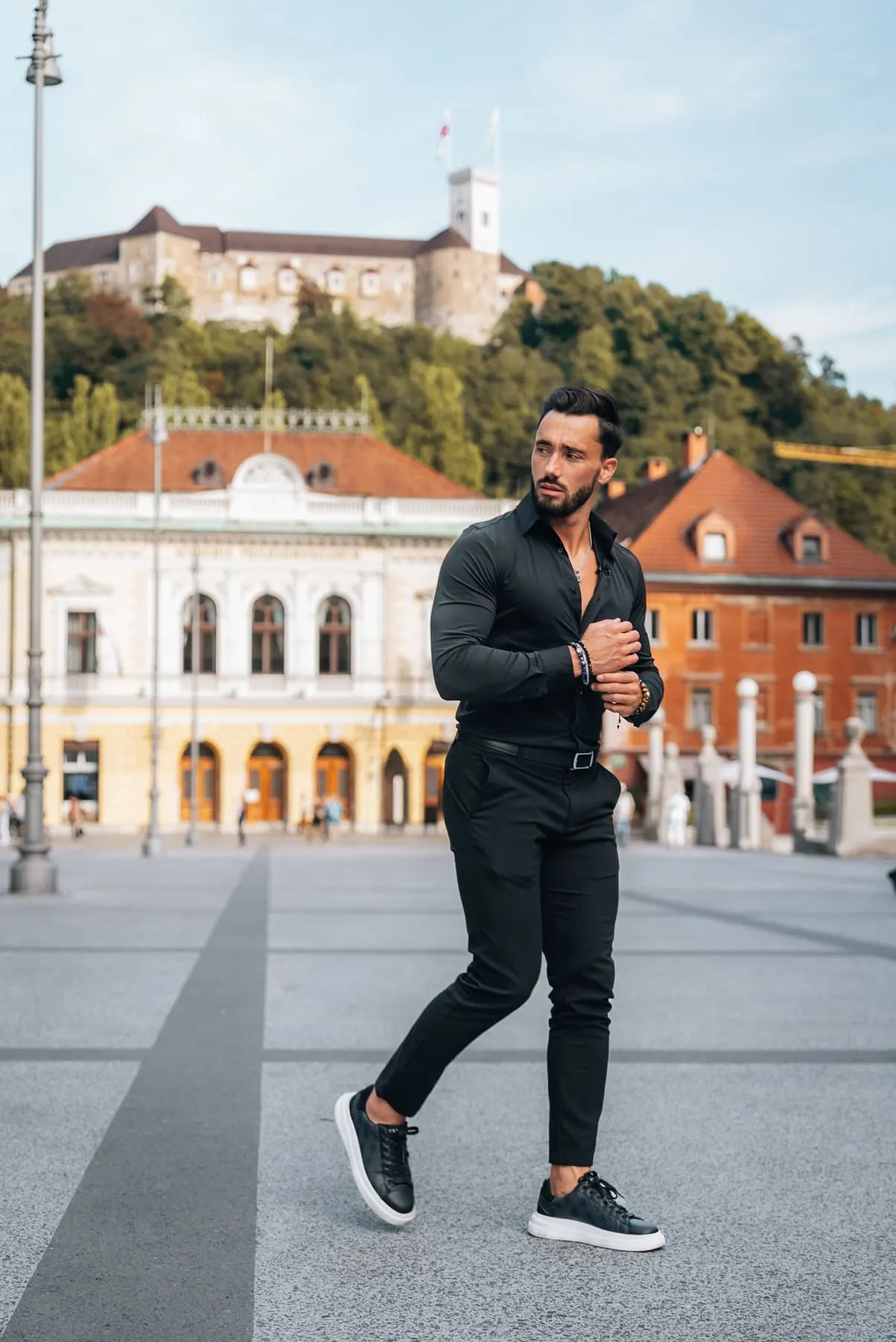Founder in front of a historic building — GT Collection, Slovenia — Agency Verse