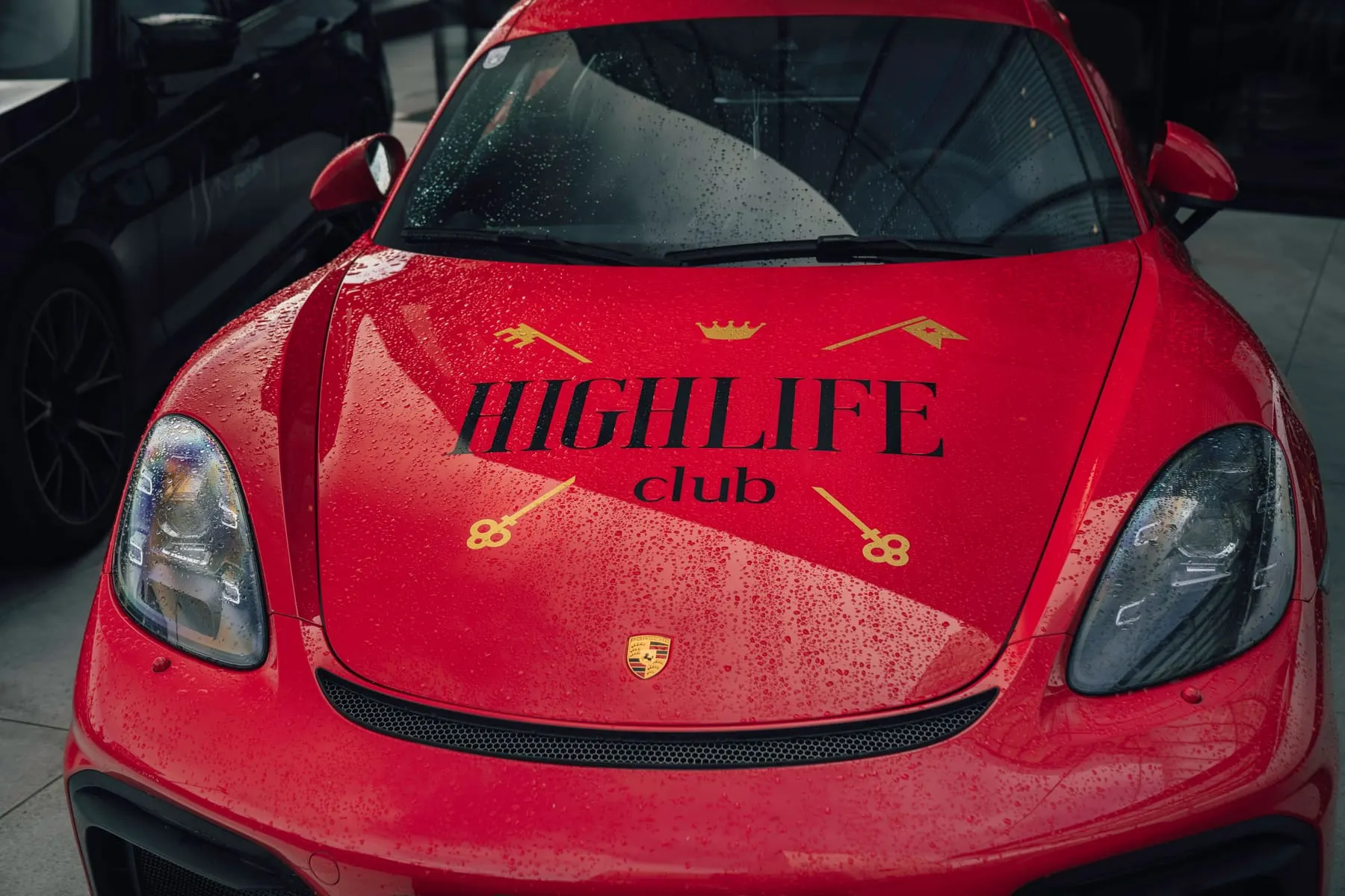 Red supercar with HighLife Club branding on the bonnet — HighLife Club — supercar meet — Agency Verse