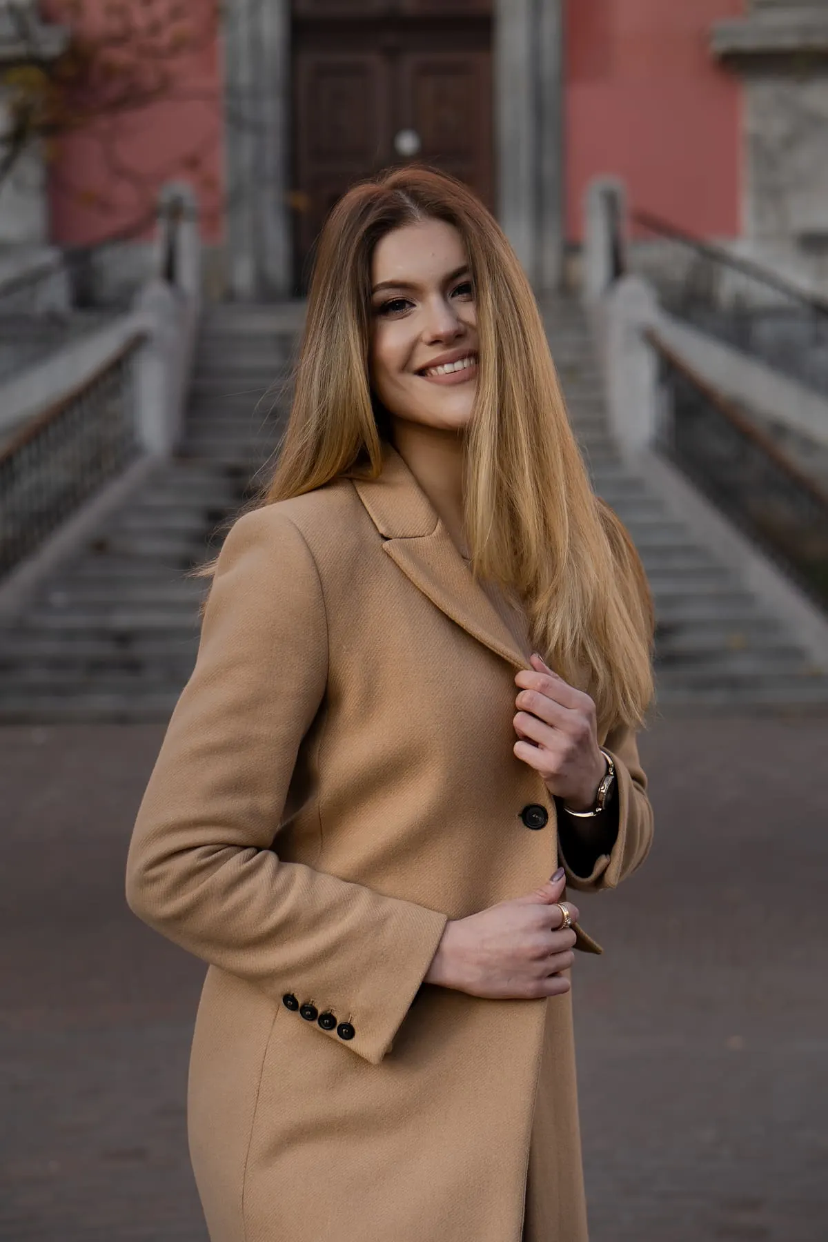 Close-up of a camel coat during a portrait session — Lia Zuljan — Agency Verse