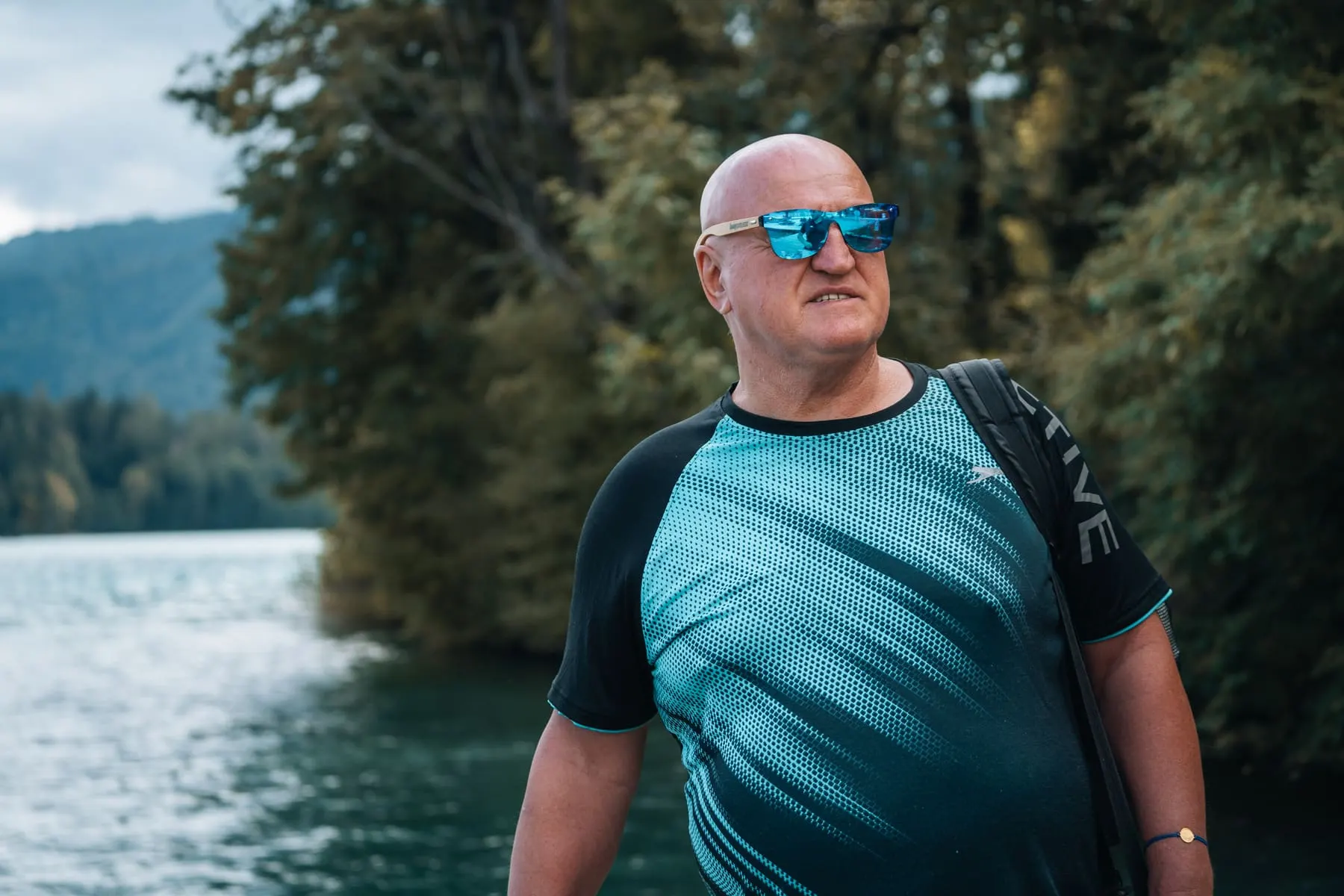 Personal-brand strategy & content — Martin Strel by a lake in sunglasses — Martin Strel, Slovenia — Agency Verse