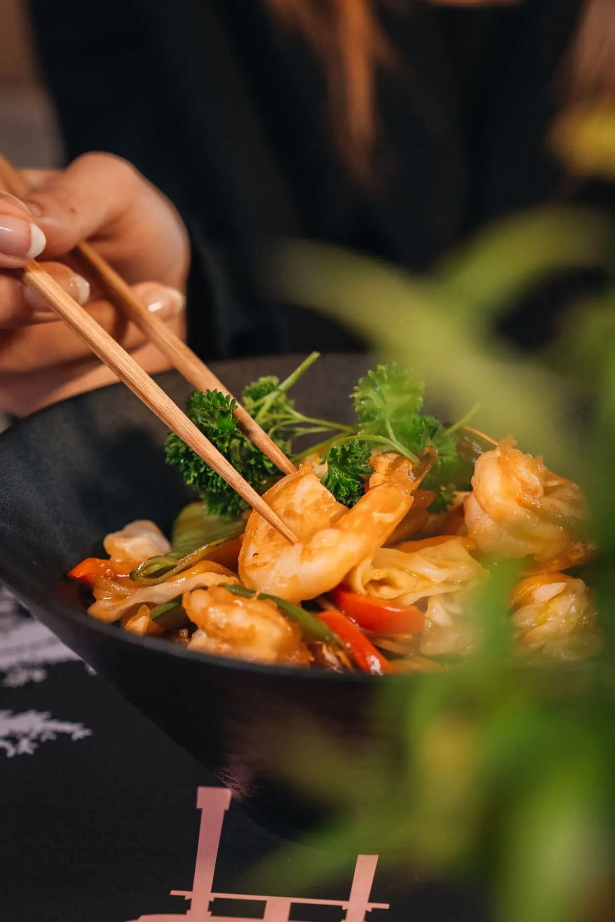 Chopsticks lifting shrimp from a bowl — Mizu, Downtown Dubai — Agency Verse