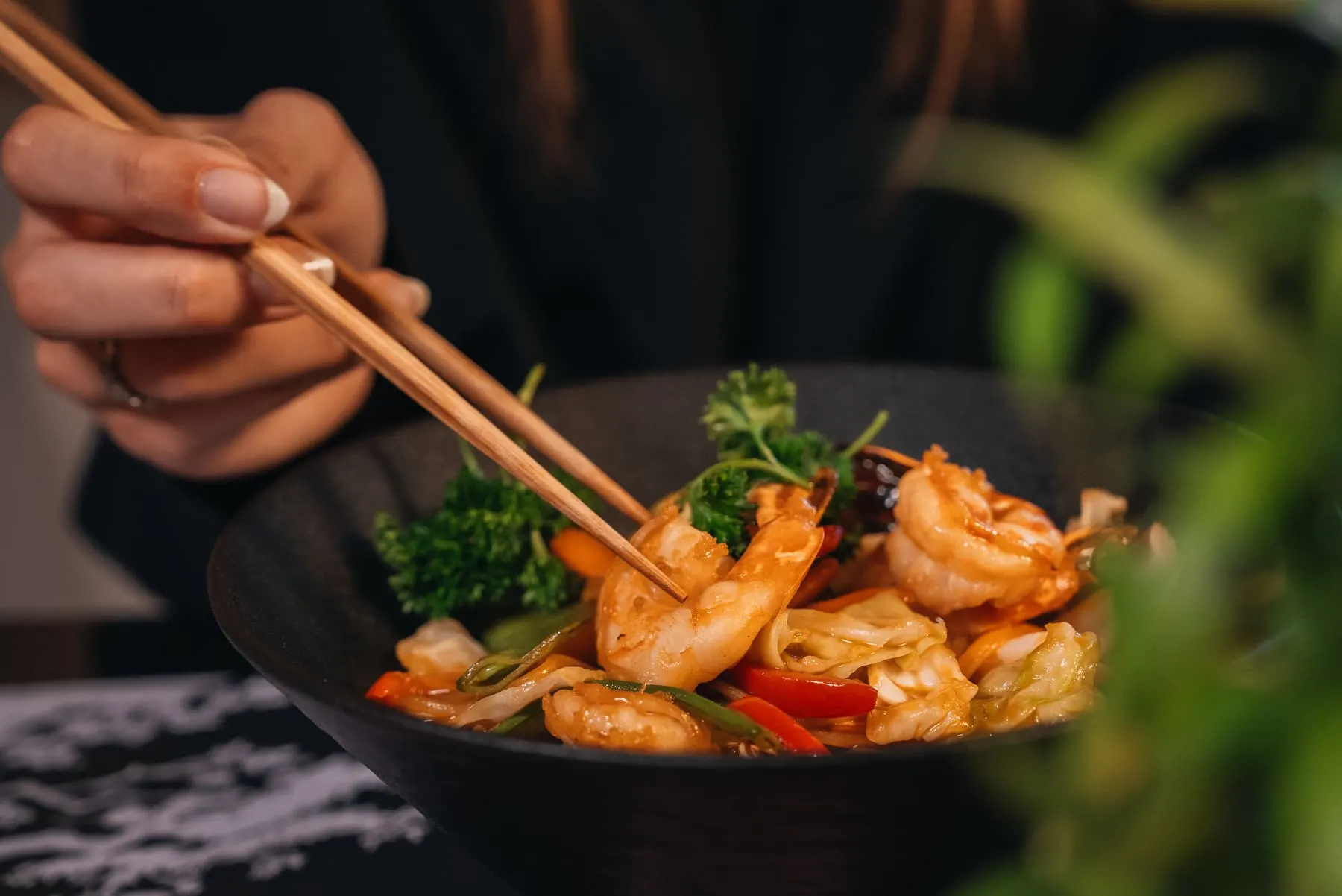 Chopsticks lifting a shrimp dish — Mizu, Downtown Dubai — Agency Verse