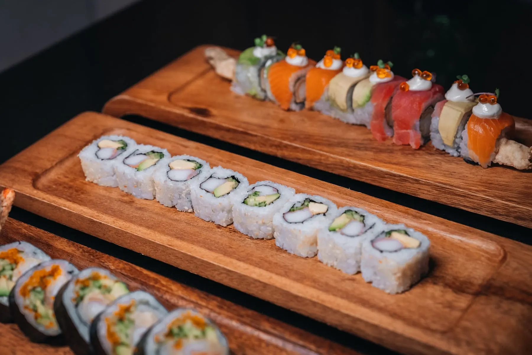 Sushi rolls on a wooden board — Mizu, Downtown Dubai — Agency Verse