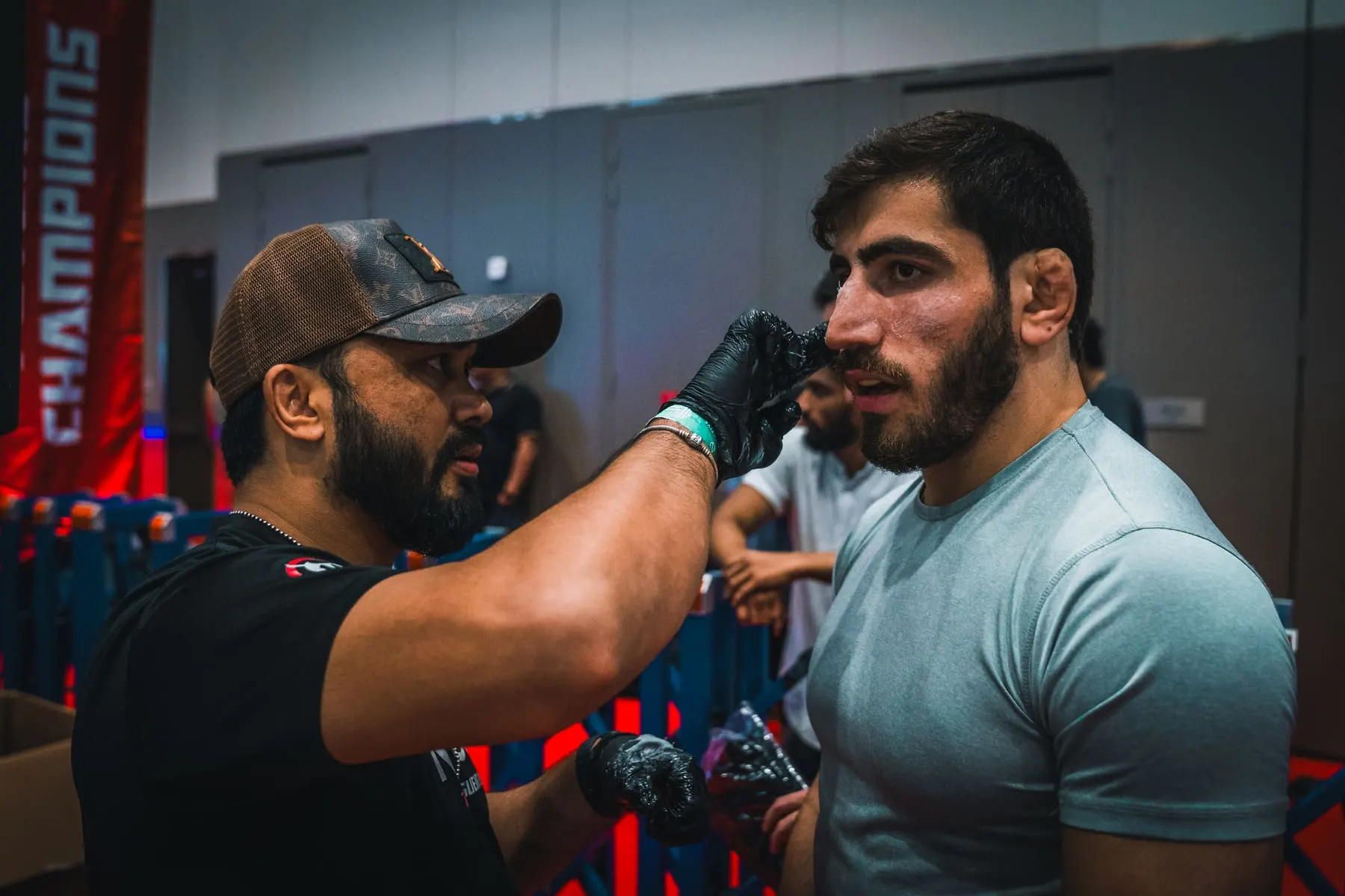 Transformation features — Athlete being prepared backstage by a coach — Muscle Show — Agency Verse