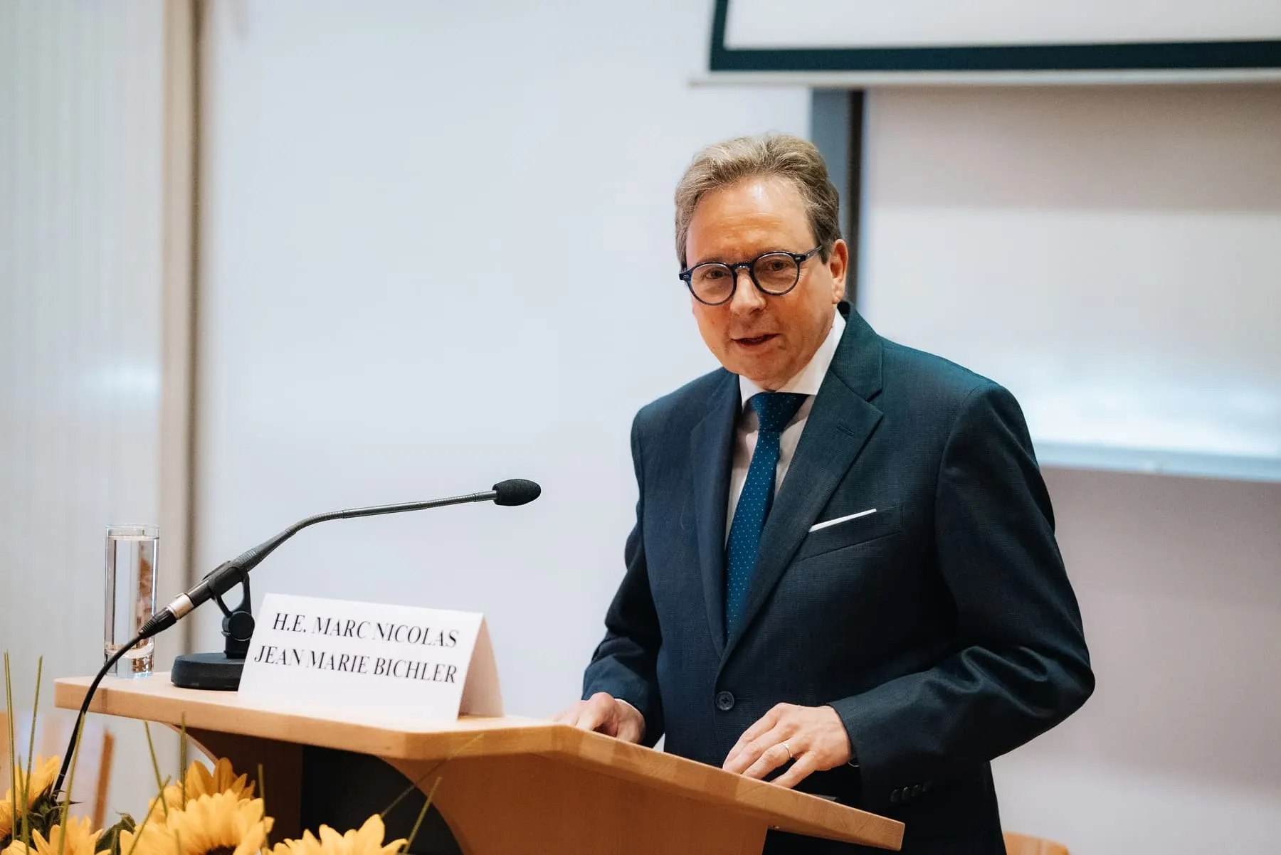 Speaker at the lectern — Global Conference on AI & Human Rights — Agency Verse