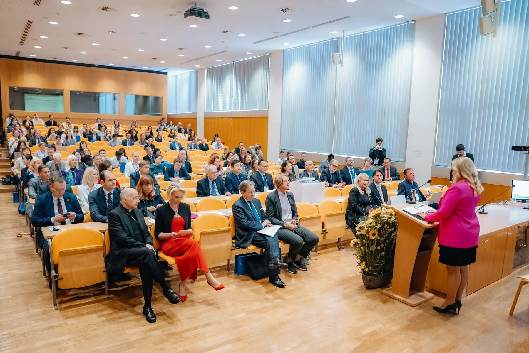 Full conference hall with a speaker at the podium — Global Conference on AI & Human Rights — Agency Verse