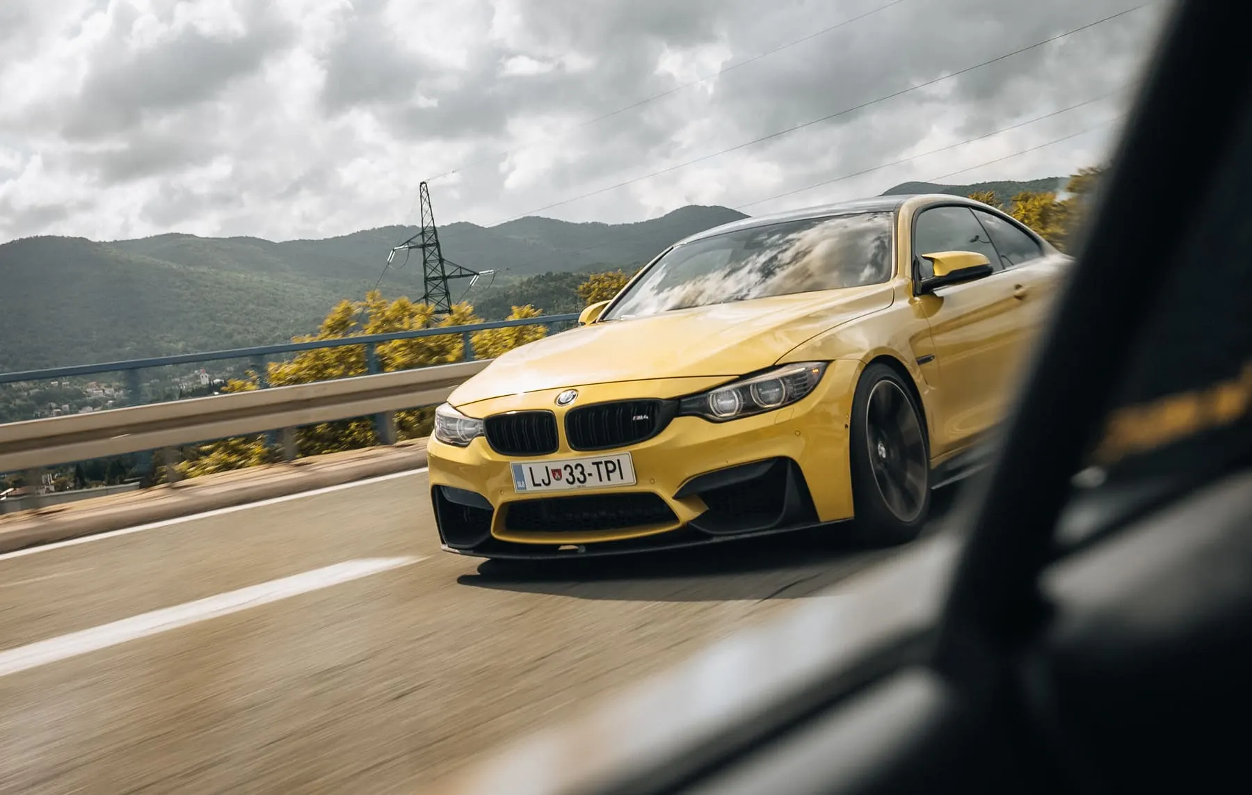 Yellow BMW M4 on a mountain road — Race Taxi — R8 track experience — Agency Verse