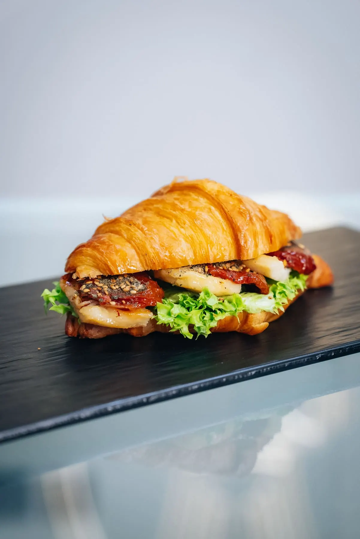 Croissant sandwich on a slate board — The Recipe Kitchen — Agency Verse