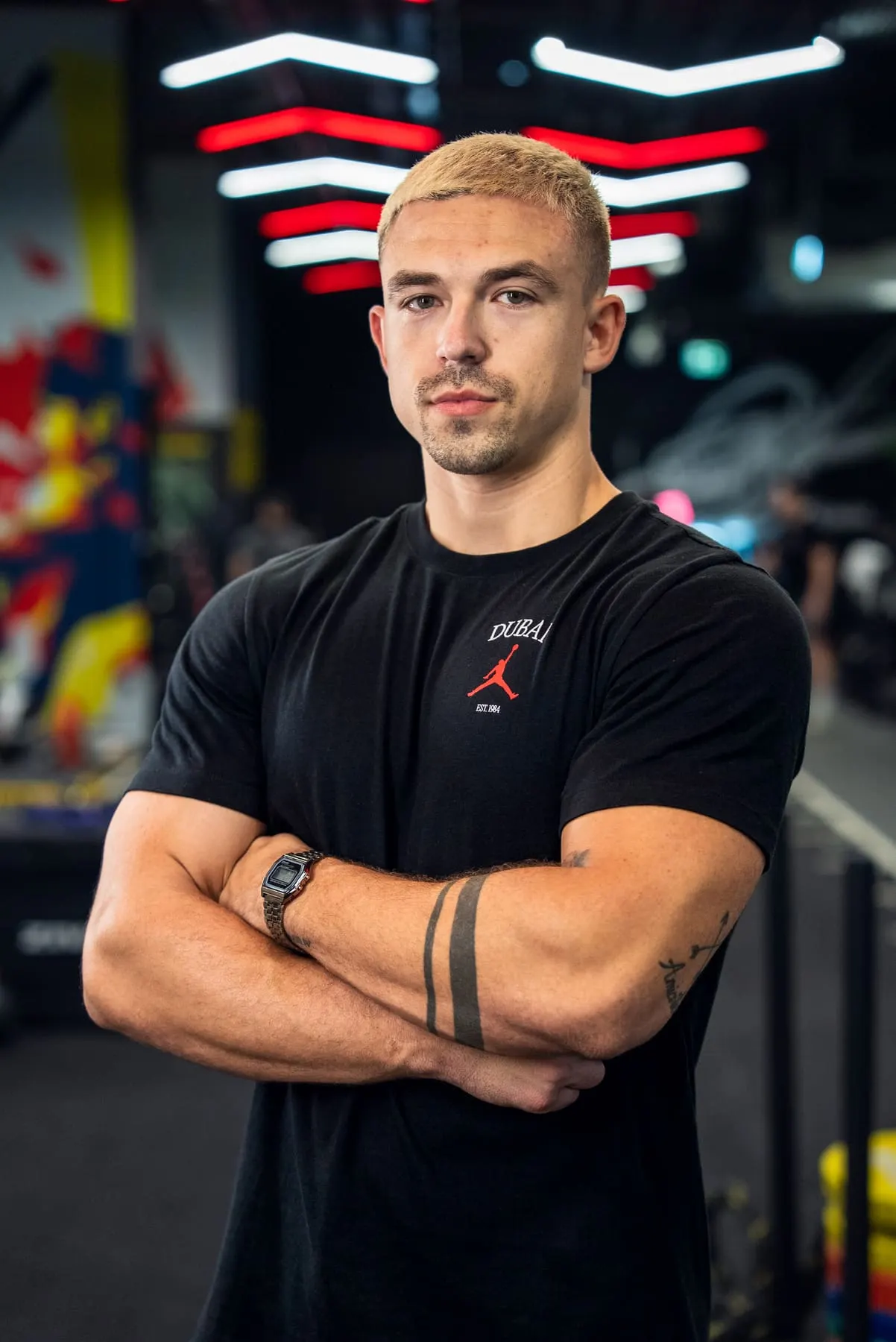 Arms crossed in a black tee — Tin Pavlić, Downtown Dubai — Agency Verse