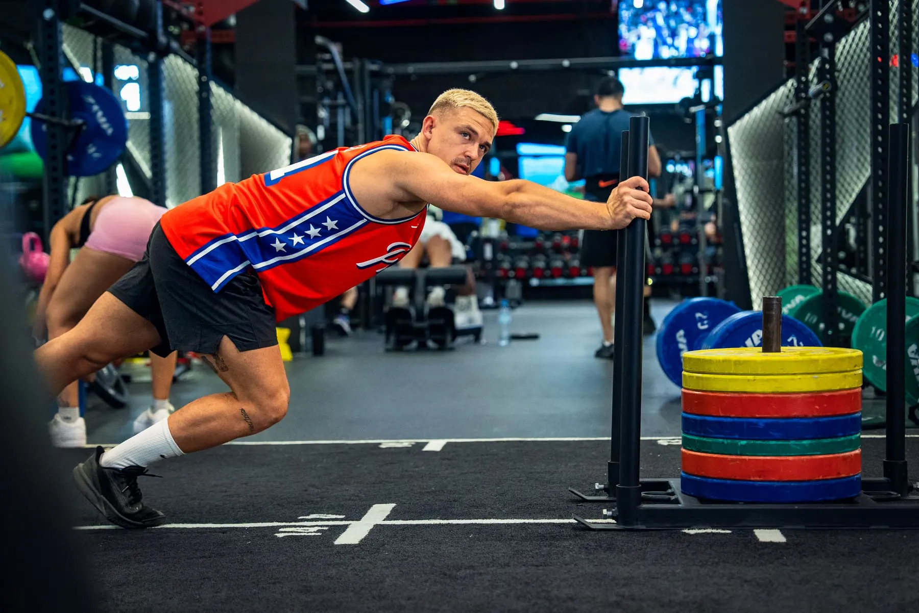 Athlete mid-movement on the gym floor — Tin Pavlić, Downtown Dubai — Agency Verse